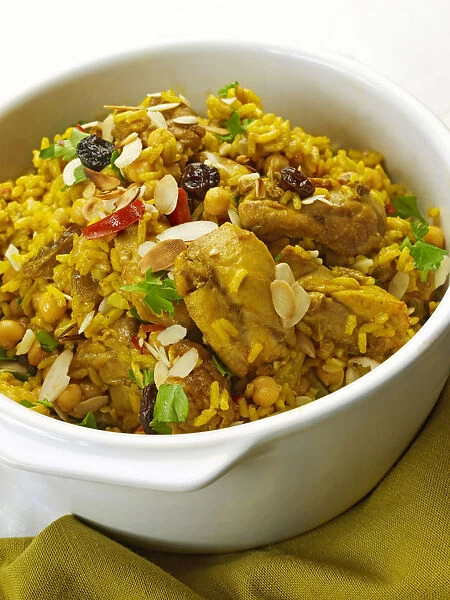 Chicken and chickpea pilaf in bowl, close-up