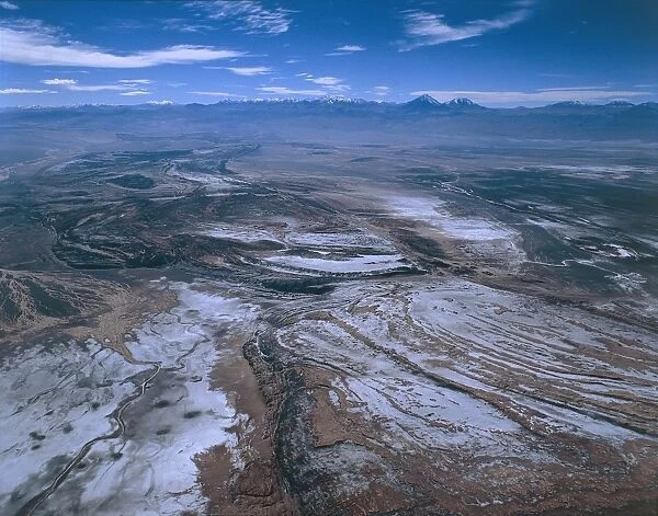 Chile, Atacama Desert, Aerial view of Valley of Moon, with salt basins Salar de Atacama and Andes in background