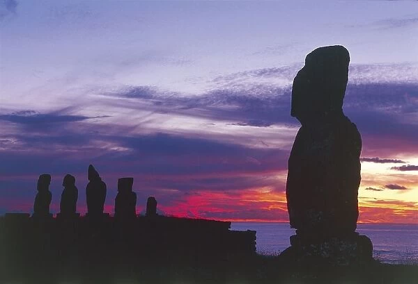 Chile, Easter Island, Rapa Nui National Park (UNESCO World Heritage List, 1995). Anthropomorphic monoliths called moais at Tahai site, Sunset