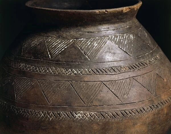 Cinerary urn decorated with engravings, Detail of geometric motif