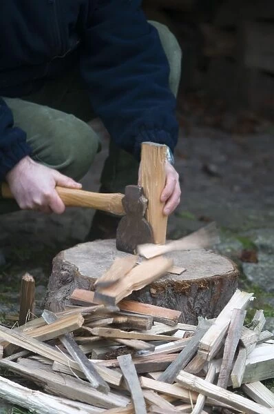 Close up of a man chopping kindling wood