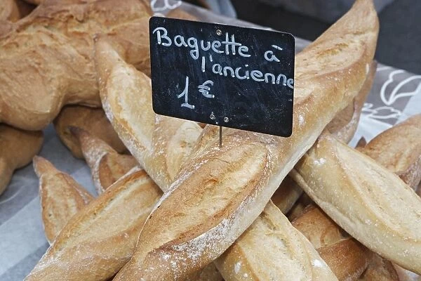 Corsica, Ajaccio, Baguette a l ancienne bread for sale at market