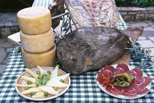 Croatia, Dalmatinski prsut a paski sir, whole and sliced seasoned and smoked Dalmatian ham, sliced sheeps cheese