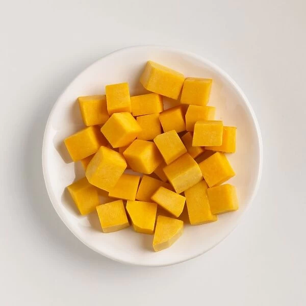Cubed pumpkin pieces on a plate