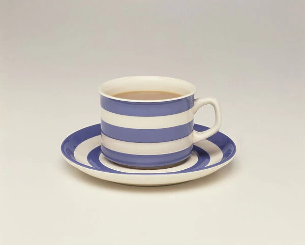 Cup and saucer filled with tea