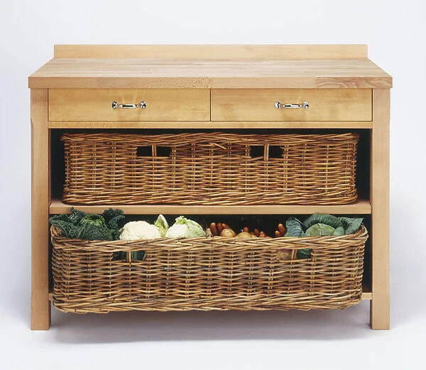 A cupboard containing wicker baskets full of vegetables