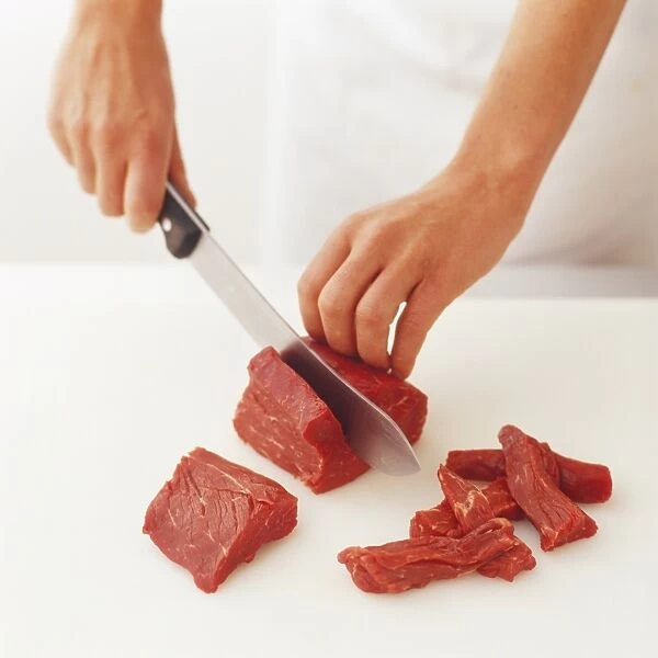 Cutting a fillet steak into strips