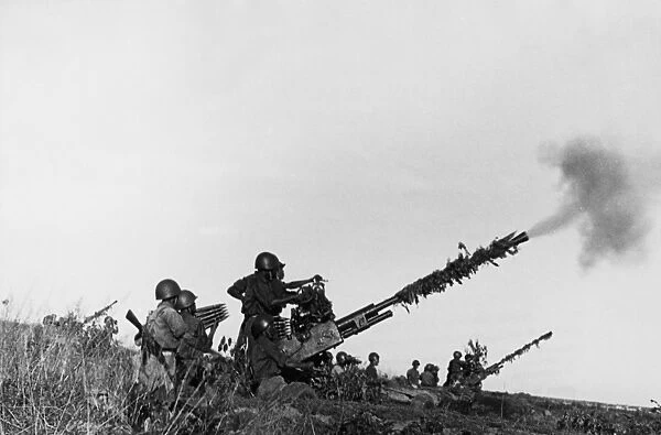 Defense of the ham zhong bridge, a north vietnamese anti-aircraft artillery emplacement fighting off an american air attack, 1966