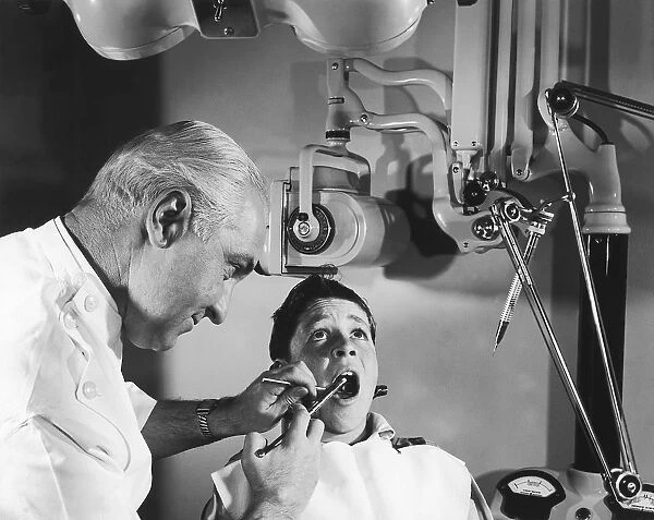 Dentist working on young boys teeth