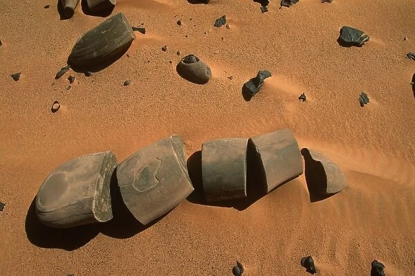 Egypt, Western Desert, Libyan Desert, Gilf Kebir, Broken stones in brown-colored soil