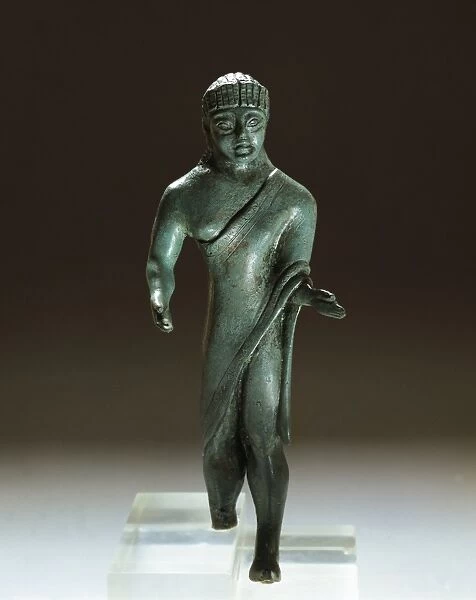 Etruscan bronze figurine of togaed man, from Villa Cassarini, Bologna, Italy, 500 B. C