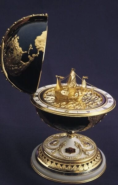 Faberge egg in the shape of a globe with a model of a ship inside (columbus ja)