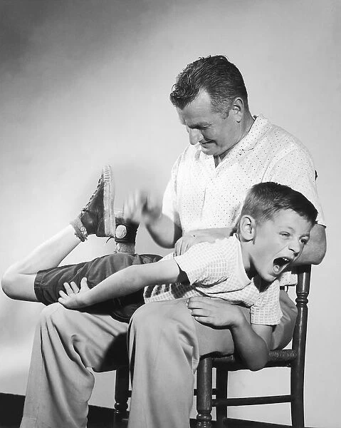Father spanking son