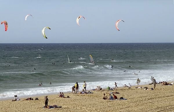 France, Gironde, Lacanau-Ocean, tourists on beach and Kiteboarding