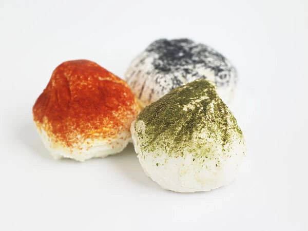 French Figuette goats cheeses on white background, ash, paprika and tarragon, close-up