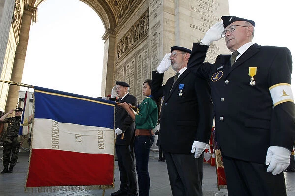 French Muslim girl scout and war veterans at the Arch of Triumph