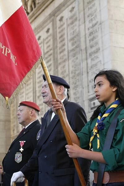 French Muslim girl scout and war veterans at the Arch of Triumph