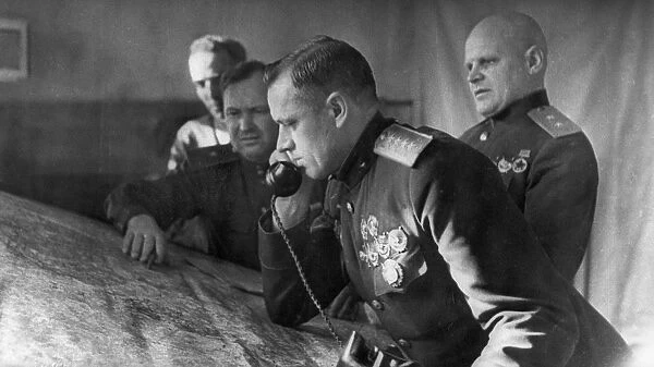 General konstantin rokossovsky, commander of the first byelorussian front, on the phone prior to the battle for stalingrad, on the right is lieutenant general telegin, member of the military council of the front