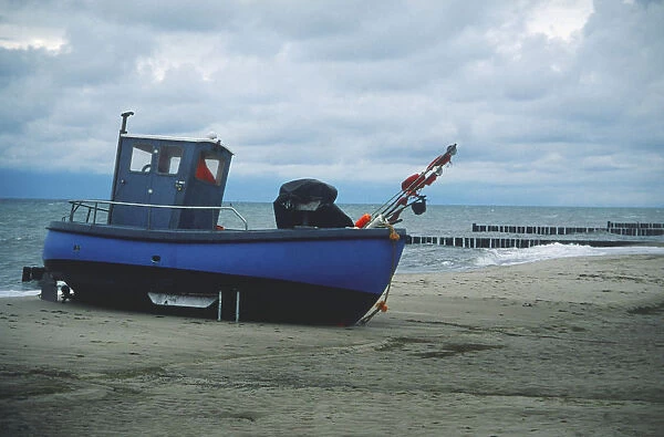 Germany, Usedom, a fishing boat on the beach