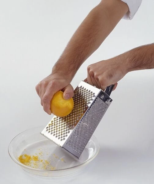 Grating lemon to remove zest