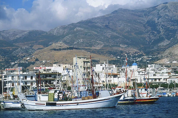 Greece, Evvoia, picturesque Karystos harbour, fishing boats moored, Mount Ochi in background