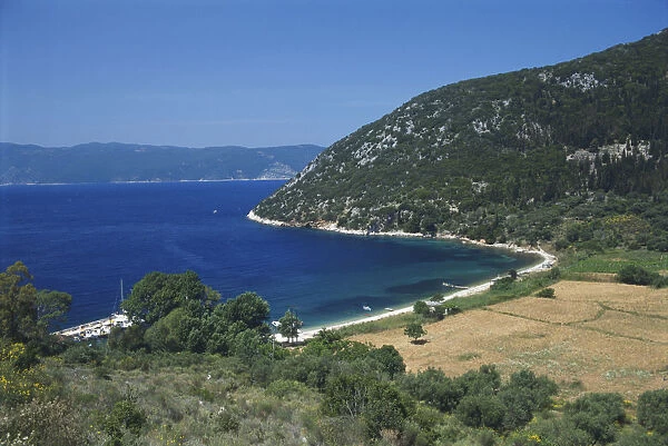 Greece, Ithaca, pebble beach of Polis Bay on the islands northwest coast, surrounded by hills and farmland