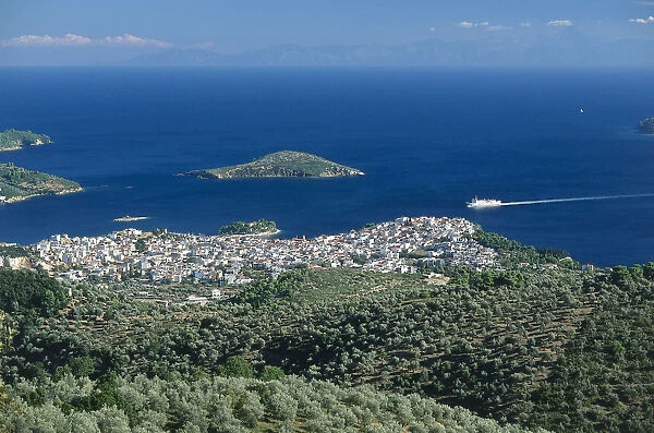 Greece, Skiathos, view of Skiathos town from the church of Profitis Ilias, sea and island beyond