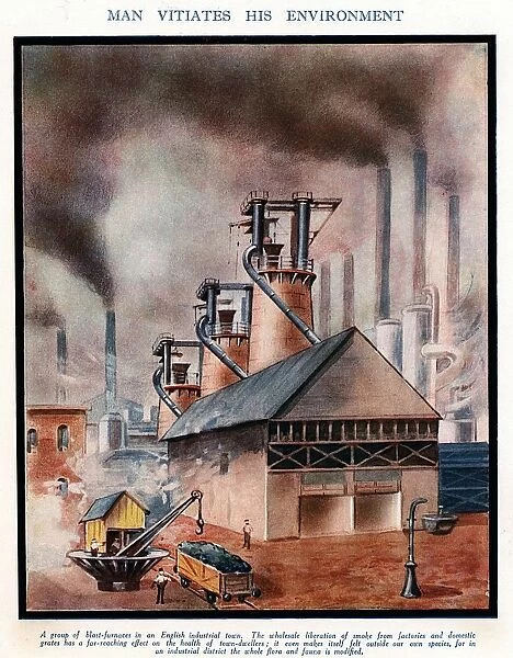 Group of typical early 20th century blast furnaces causing with smoking chimneys