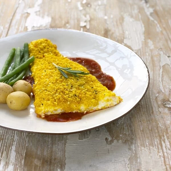 Halibut in rosemary and garlic crust, served with French beans, boiled potatoes and tomato sauce