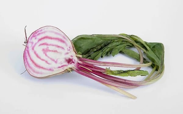 Halved beetroot on white background, close-up