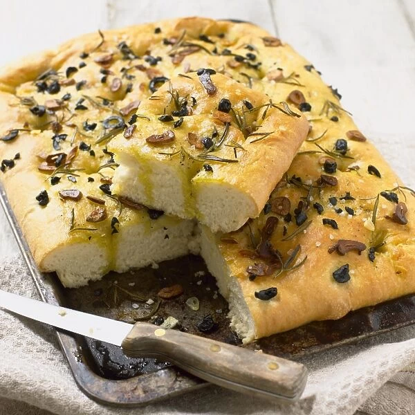Herb bread topped with rosemary, garlic and olives