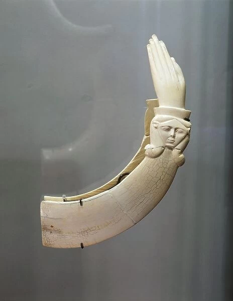 Hippopotamus ivory claquettes (castanets) in the shape of hand with carving depicting head of goddess Hathor