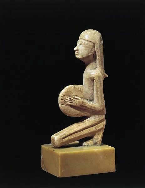 Hippopotamus ivory statue of a tambourine player from Syria