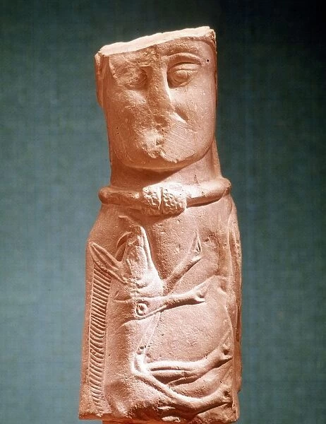 Image of Celtic deity with wild boar and wearing torque. Stone. Musee de St Germain