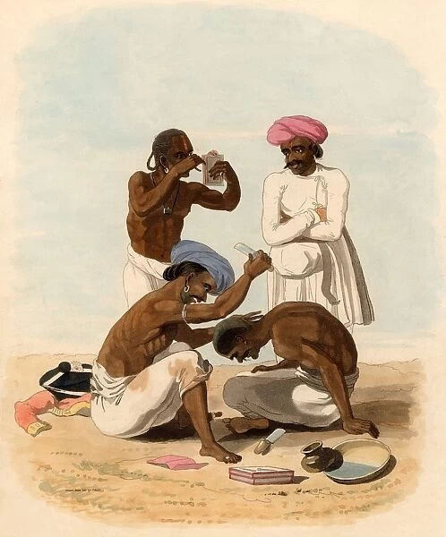 Indian barber. In the foreground a barber is shaving the head of a client. Standing