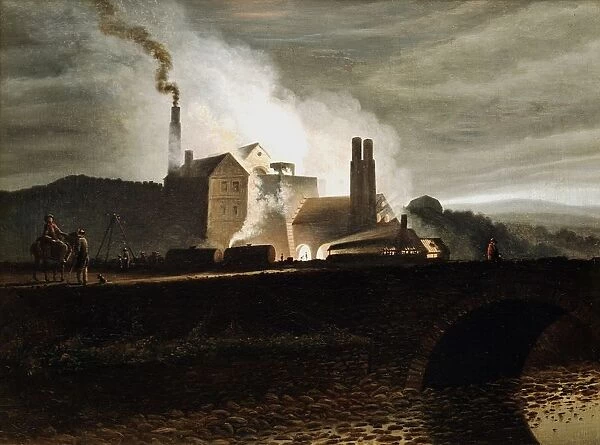 Industrial landscape. Ironworks at night, blast furnace in centre. Wales. Artist