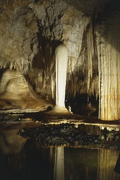 Interior of Lake Cave, near Margaret River, a fairland of limestone formations, reflected in dark underground waters