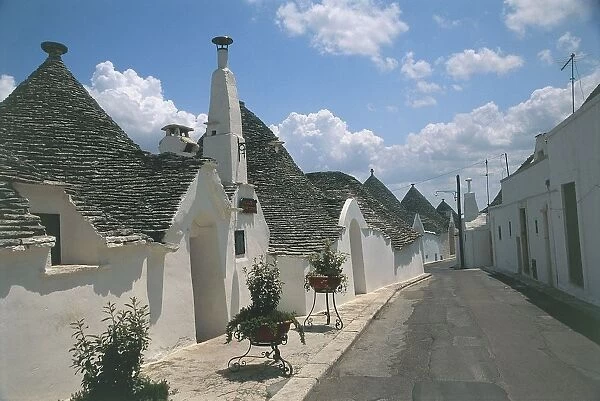 Italy, Apulia Region, Le Murge Rione Aia Piccola, Trulli houses along street