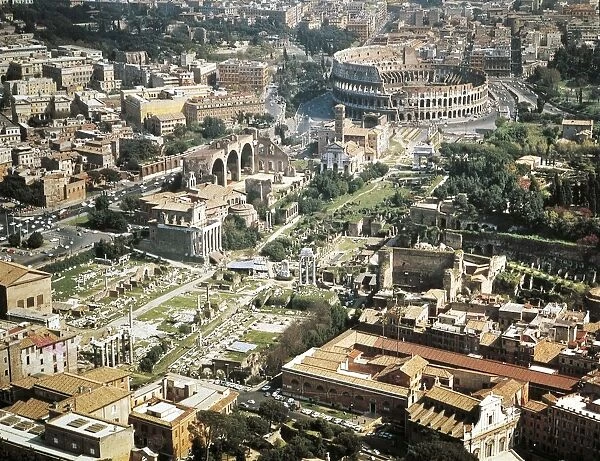 Italy, Lazio Region, Rome, Aerial view of Roman Forum and Flavian amphitheater Colosseum