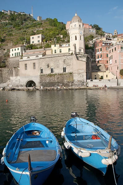 ITALY, Liguria, Cinque Terre, Vernazza, harbour with blue fishing boats