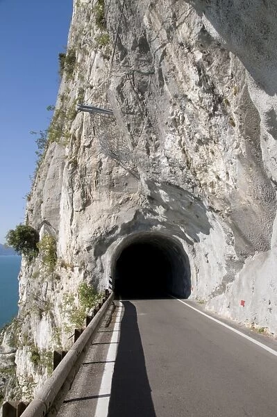 Italy, Lombardy, Lake Garda, Tremosine, tunnel & road climbing to village of Pieve