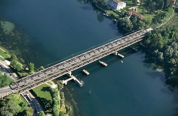 Italy, Lombardy, Sesto Calende, Iron bridge over Ticino River, aerial view