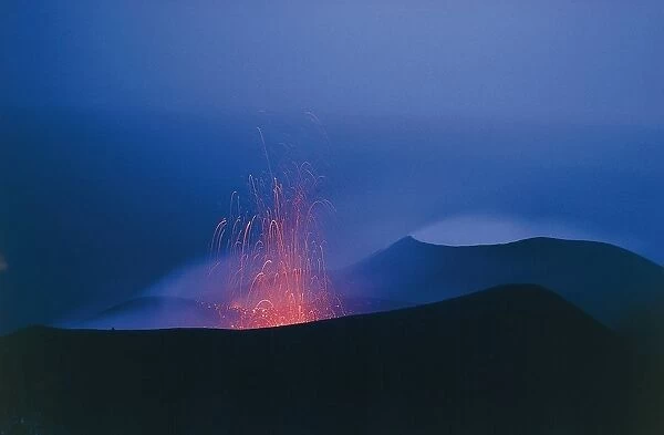 Italy, Sicily Region, Mesina Province, Aeolian Islands, Stromboli Island, volcanic eruption at dusk