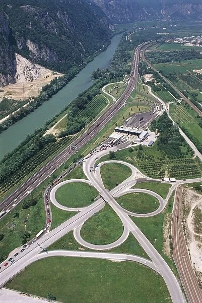 Italy, Trentino-Alto Adige Region, Province of Bolzano, Aerial view of Brennero A22 Highway exit at Trento