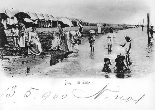 Italy, Venice, children playing in water, watched over by mothers and governesses at Lido Baths, postcard, 1900