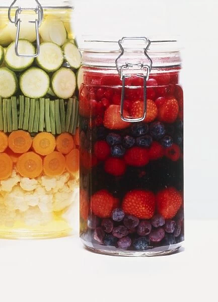 Jar of preserved vegetables and berries