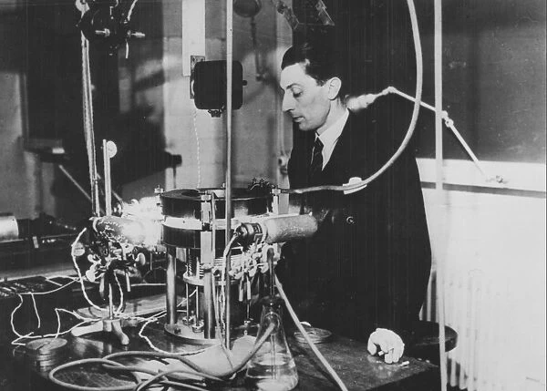 (Jean) Frederick Joliot-Curie (1900-1958), French physicist, in about 1930. The apparatus