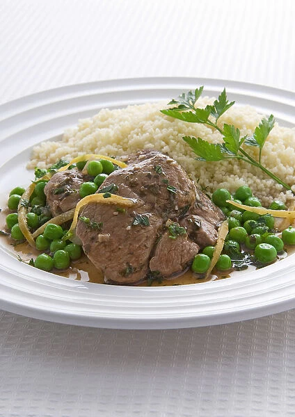 Lamb braised with green peas and couscous