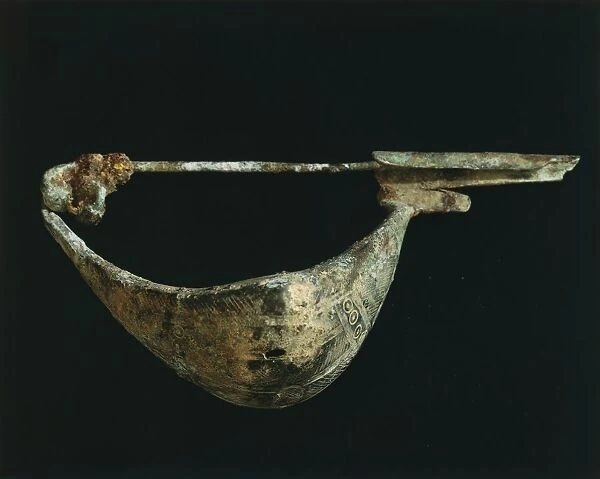 Large bronze fibula in shape of boat