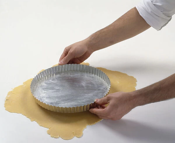 Lining tart tin, placing tin on top of rolled out dough to check the size needed